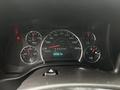Dashboard of a 2023 GMC Savana displaying speedometer and other gauges showing 24722 kilometers driven