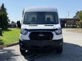 Front view of a 2022 Ford Transit van with a white exterior and black accents