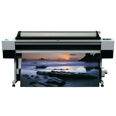 Epson Stylus Pro 11880 large-format printer displaying a vivid sunset landscape print with visible rolled media in the foreground