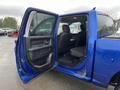 A 2019 RAM 1500 Classic with an open passenger door showing the interior seating and cabin layout