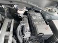 A close-up view of a 2022 Kia Sorento's engine compartment focusing on the battery and surrounding components