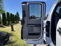 A 2020 Ford F-350 SD truck door is open showing the interior features including the door panel and handle