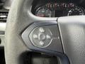Black steering wheel with cruise control buttons in a 2016 Chevrolet Tahoe featuring symbols for resume, set, and a cancel option