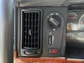 Interior controls of a 2005 Volvo VND 122 including an air vent and various switches for lights and the fan