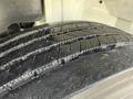 A close-up view of a heavily treaded tire from a 2011 International 4300 showing detailed grooves and rubber texture
