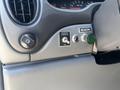 The interior dashboard of a 2008 Ford E-350 featuring a control panel with a switch for a beacon light and a power button labeled Versalift
