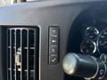 Close-up of the control panel in a 2020 Chevrolet Express featuring buttons for air conditioning and vehicle functions