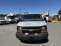 Front view of a 2007 Chevrolet Express van with a light-colored hood and a black lower bumper displaying a Chevrolet emblem
