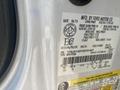 A white 2013 Ford Expedition with a visible vehicle information tag detailing specifications and manufacturing details