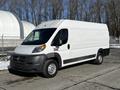 A 2017 RAM Promaster van with a white exterior and a large cargo area showing no visible markings on the sides