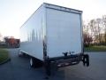 A 2014 International Durastar truck with a large white cargo box and a distinctive rear loading door