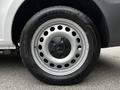 A close-up of a silver alloy wheel with a black center cap featuring the Mercedes-Benz logo and a Goodyear tire mounted on it