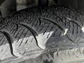 Close-up of a tire from a 2011 Dodge Grand Caravan showing detailed tread pattern and rough texture