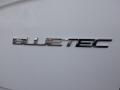 2016 Mercedes-Benz Sprinter with a chrome "BLUETEC" badge in the foreground