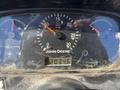 Dashboard of a 2008 John Deere 3320 300X with gauges for speed and hours readout showing 20346