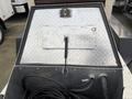 2005 Katolight SED60FPJ4 generator with a silver metal exterior and a black handle for access to the internal components and cable connections