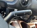 Close-up view of the turn signal and wiper control stalk in a 2021 Hino 338 truck interior