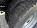 Close-up of the tires on a 2016 Ford F-550 showcasing their tread pattern and rugged design