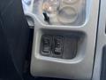 Control panel of a 2008 International DuraStar featuring two black switches labeled for fog lights and park regeneration