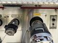 Close-up of a 2006 Emergency One Fire Truck's discharge nozzles with labeled outlets for water discharge