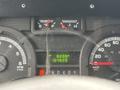 Dashboard of a 2018 Ford Econoline displaying speedometer fuel level and trip meters with mileage readings