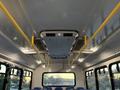 Interior view of a 2019 Chevrolet Express showing the ceiling with ventilation system and yellow grab rails