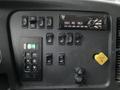 Dashboard of a 2020 Freightliner 114SD featuring various controls and buttons including radio display and parking indicator