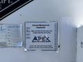 A sign attached to a 2009 Kenworth T270 outlining the annual mechanical inspection details and contact information for Apex Heavy Duty and Aerial Repair