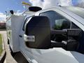 A 2024 Ford F-550 truck with a side mirror and a service body attachment is prominently displayed in the image