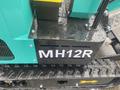 2024 AGT Industrial MH12R Mini Excavator featuring a black housing with the model number MH12R visible on the side and a textured track beneath it