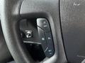 Close-up of the steering wheel controls of a 2017 Chevrolet Express showing buttons for cruise control and other settings