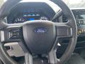 View of a steering wheel in a 2017 Ford F-250 SD featuring the Ford logo and control buttons on the left side