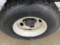 Close-up of a black and white tire mounted on a vehicle rim featuring the word Hercules on the sidewall