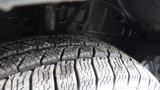 Close-up of a 2018 Ford Transit tire showcasing the tread pattern and surface details