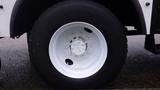 Close-up of a white wheel with a circular rim and black tire from a 2005 International 4300 truck