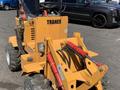 A yellow 2024 Traner TR 45 compact loader with a front bucket and visible hydraulic arms parked on a surface