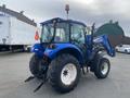 A blue 2016 New Holland T475 tractor with a front loader attachment and large rear tires