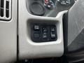 Close-up of a 2019 International 4300 dashboard control panel featuring buttons for mirror adjustment light indicators and panel settings
