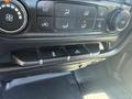 Control panel of a 2016 GMC Sierra 1500 featuring buttons for air conditioning climate control and additional features like hazard lights and tailgate release