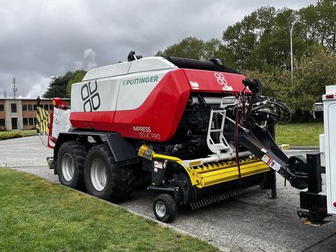 A 2020 Pottinger Impress forage harvester with a red and white design features a large cutting platform and dual wheels for agricultural use