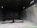 Interior view of a 2015 Freightliner M2 106 showing a dark enclosed cargo space with streaks of liquid on the floor