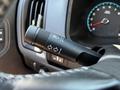 A close-up view of the turn signal lever on a 2021 Chevrolet Colorado steering column showing the controls for headlights and turn signals