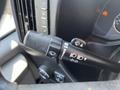 The image shows the control lever of a 2013 Chevrolet Express featuring symbols for windshield wipers and headlights