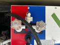 Close-up of a control panel with two clear knobs labeled for water flow adjustments on a 2000 Ford Motorhome