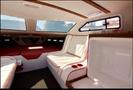 Interior of a 1989 Nordic Viking boat featuring white and red seating with cup holders and storage compartments