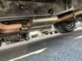 A vintage 1962 Ford F-100 truck with a visible exhaust system highlighting the muffler and pipes beneath the vehicle