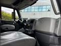 Interior of a 2011 International 4400 with a gray driver's seat dashboard and steering wheel visible