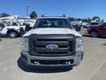 A white 2016 Ford F-350 Super Duty truck with a black grille and Ford logo in the center