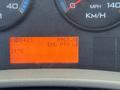 Dashboard display of a 2018 International DuraStar showing speedometer fuel gauge and odometer reading of 8965 kilometers with warning lights illuminated and temperature reading of 21 degrees Celsius
