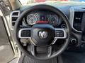 Steering wheel of a 2020 Ram 2500 with controls and instrument cluster displayed in front